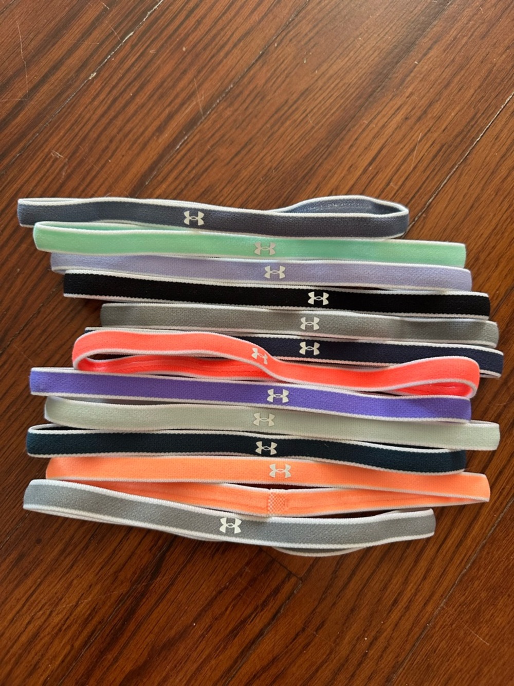 (12) Under Armour Elastic Sport Headbands in various colors shown